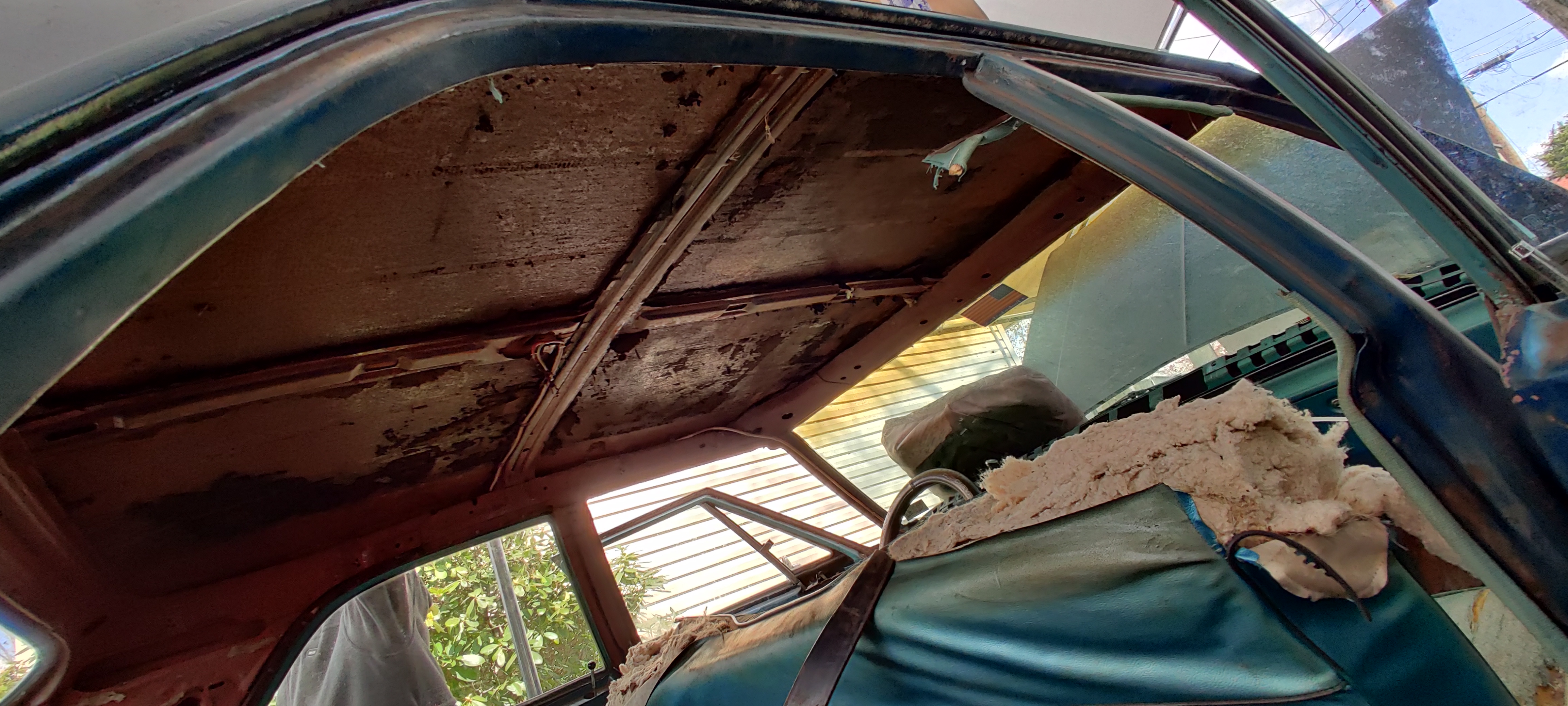 Ceiling of the impala with no fabric or insulation